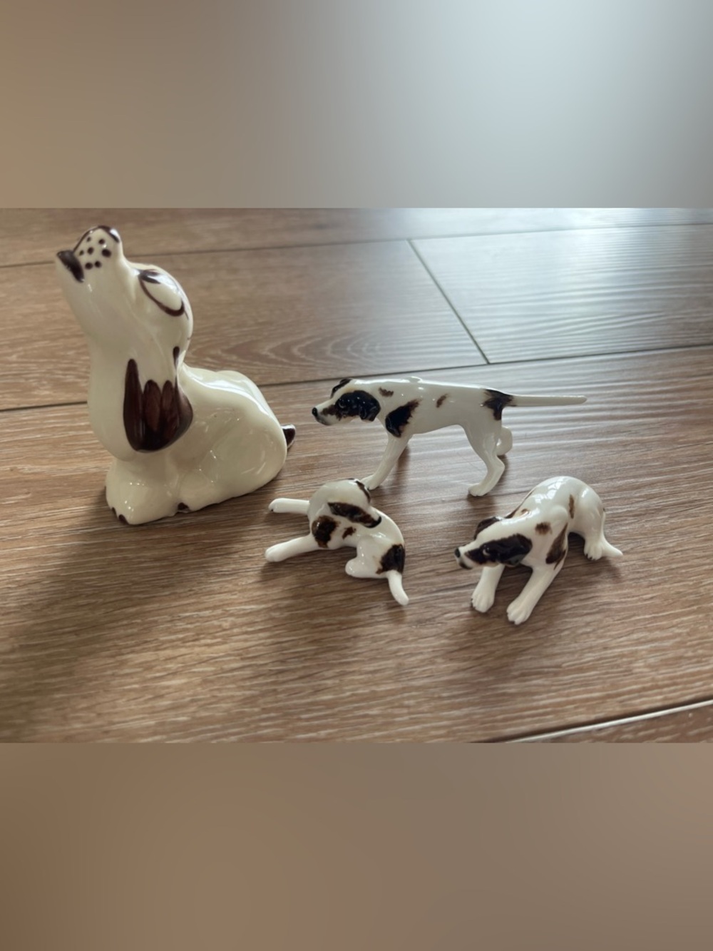 Miniature brown and white porcelain dog figurines set of 4